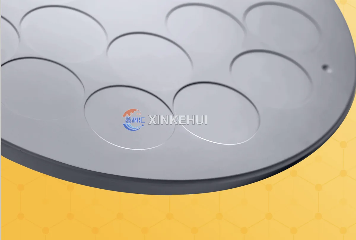 Close-up of graphite tray pocket edges, recessed seats and peripheral mounting feature